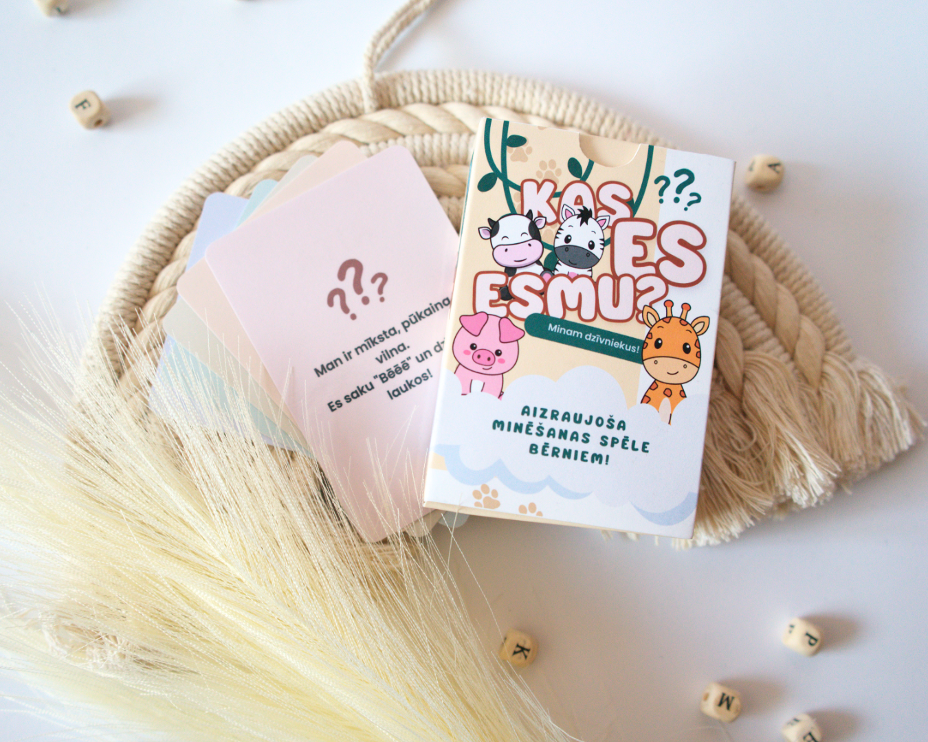 Two children's books on a woven mat with decorative elements